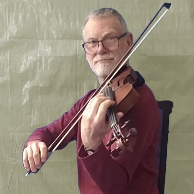 John Rogers wears a red shirt and plays the violin